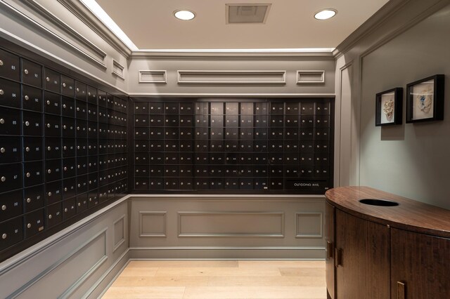 view of community featuring mail area, recessed lighting, and ornamental molding