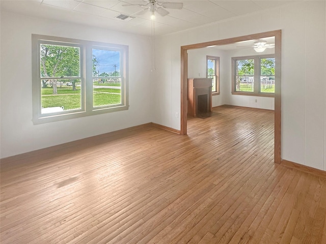 320 E S Main St, Flatonia, TX 78941 - spare room with a ceiling fan, light wood-type flooring, and baseboards