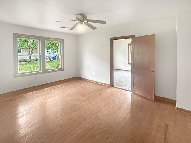 320 E S Main St, Flatonia, TX 78941 - empty room featuring ceiling fan, light wood finished floors, and baseboards