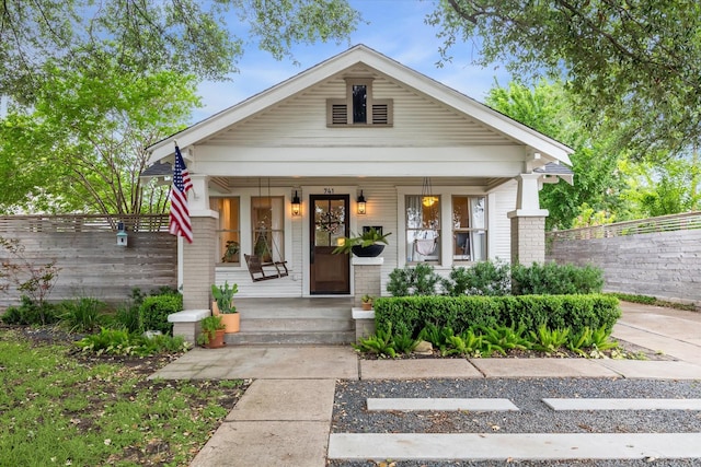 741 E 13th 1/2 St, Houston, TX 77008 - view of front of property with covered porch, fence, and brick siding