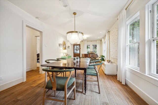 741 E 13th 1/2 St, Houston, TX 77008 - dining space with light wood-type flooring, healthy amount of natural light, and baseboards