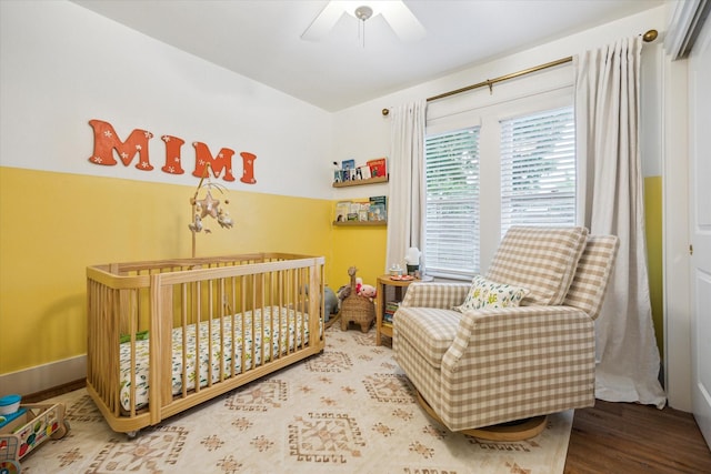 741 E 13th 1/2 St, Houston, TX 77008 - bedroom with a crib, wood finished floors, and a ceiling fan