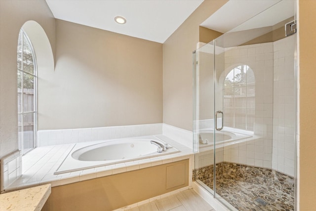 1301 Wilderness Pines Dr, Friendswood, TX 77546 - bathroom with a garden tub, a shower stall, and tile patterned flooring