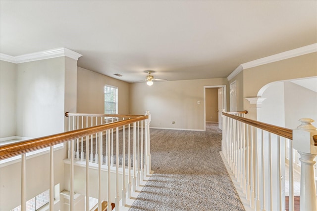1301 Wilderness Pines Dr, Friendswood, TX 77546 - hall with an upstairs landing, carpet flooring, crown molding, baseboards, and arched walkways