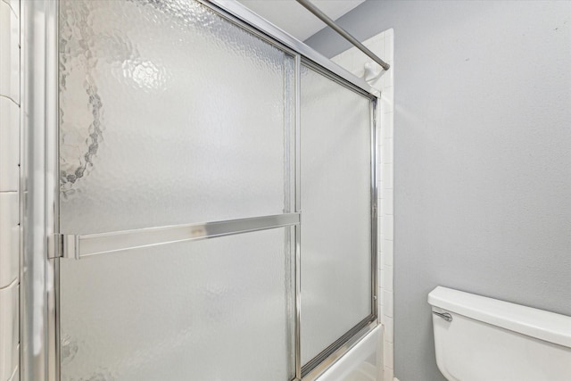 1301 Wilderness Pines Dr, Friendswood, TX 77546 - full bathroom with toilet and bath / shower combo with glass door