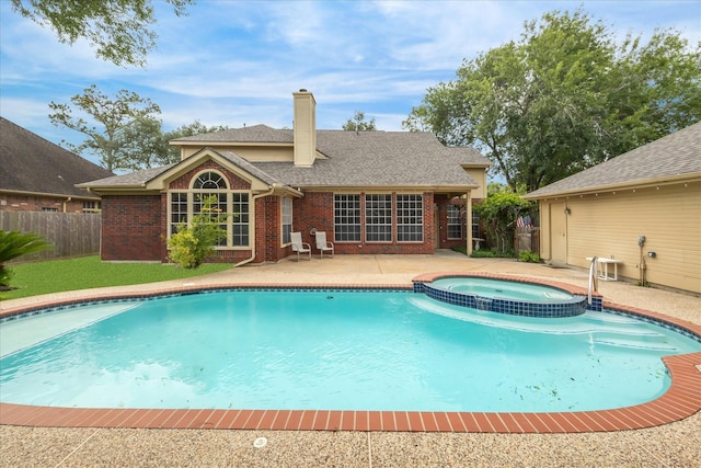 1301 Wilderness Pines Dr, Friendswood, TX 77546 - view of swimming pool featuring a patio and a pool with connected hot tub