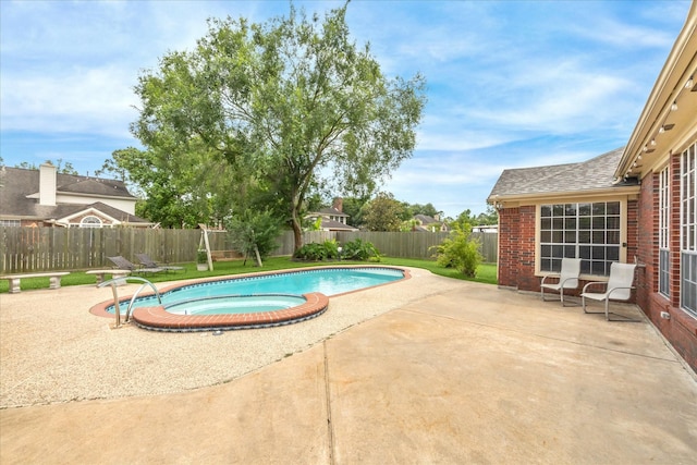 1301 Wilderness Pines Dr, Friendswood, TX 77546 - view of swimming pool with a patio and a pool with connected hot tub