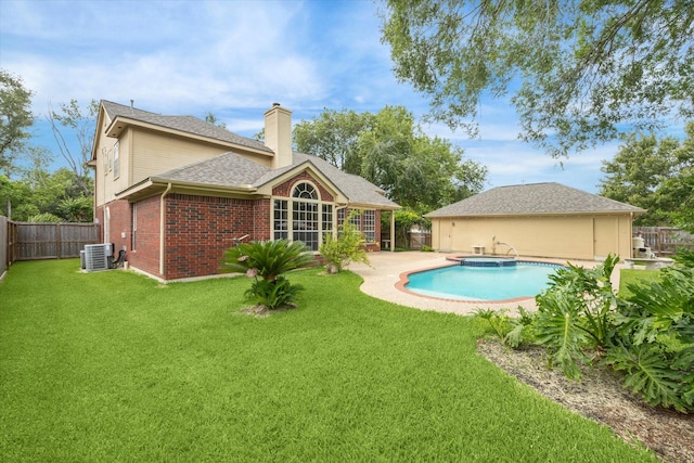 1301 Wilderness Pines Dr, Friendswood, TX 77546 - back of house with brick siding, a chimney, a patio area, a shingled roof, and cooling unit