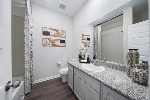 11034 Moon Light Dr, Needville, TX 77461 - bathroom with wood finished floors, toilet, baseboards, and vanity