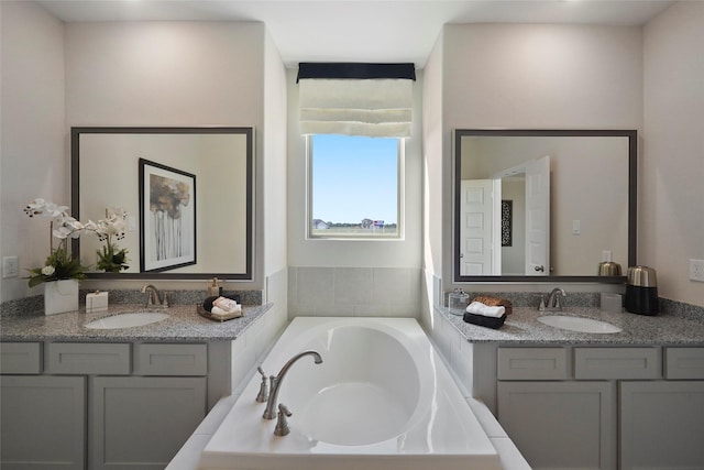 11034 Moon Light Dr, Needville, TX 77461 - full bathroom featuring a bath and two vanities