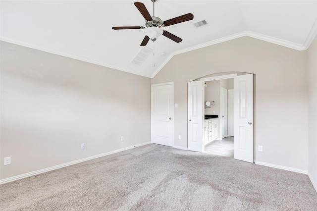 23435 Banks Mill Dr, New Caney, TX 77357 - unfurnished bedroom featuring vaulted ceiling, carpet, arched walkways, crown molding, and baseboards