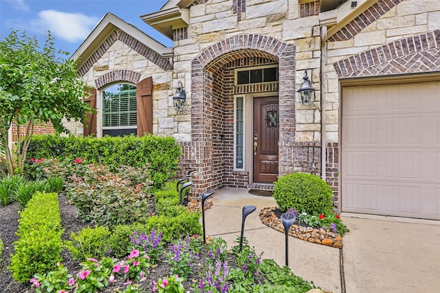 23435 Banks Mill Dr, New Caney, TX 77357 - property entrance featuring stone siding and an attached garage