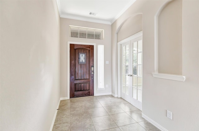 23435 Banks Mill Dr, New Caney, TX 77357 - foyer featuring crown molding, french doors, baseboards, and light tile patterned flooring