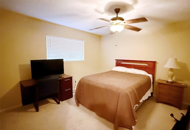 bedroom with light colored carpet and ceiling fan