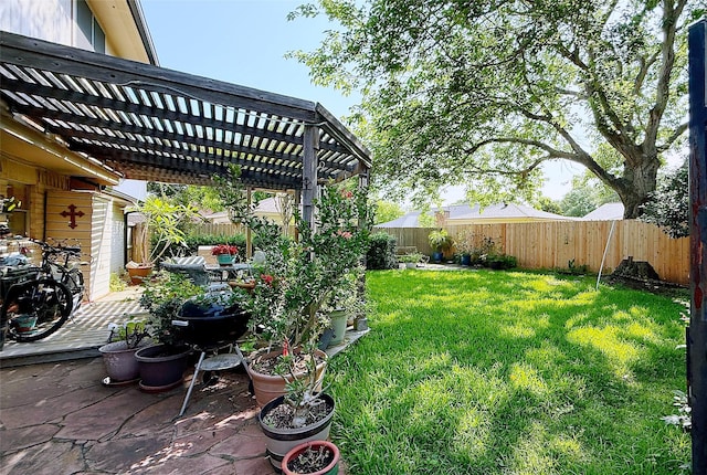 view of yard with a pergola and a patio