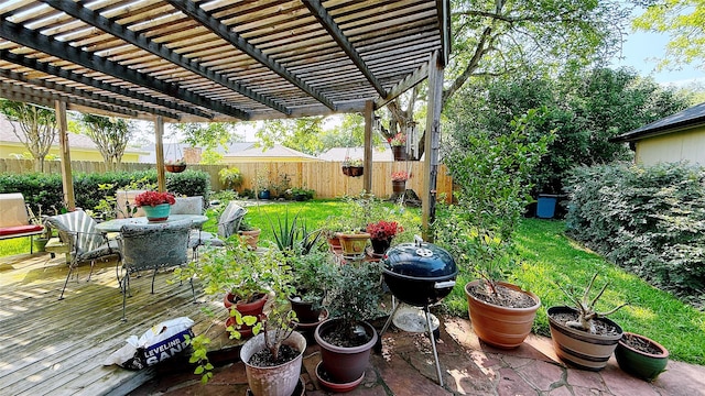 view of yard featuring outdoor dining space, a pergola, and a wooden deck