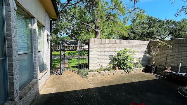 view of patio featuring fence