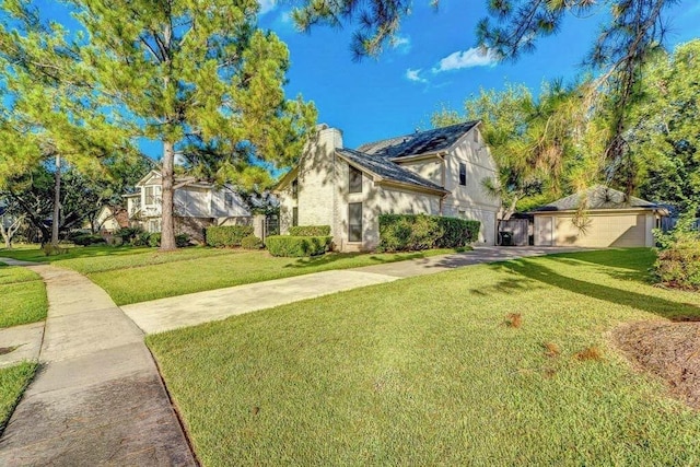 2707 Williams Grant St, Sugar Land, TX 77479 - view of front of home with a chimney, a garage, a front yard, and driveway