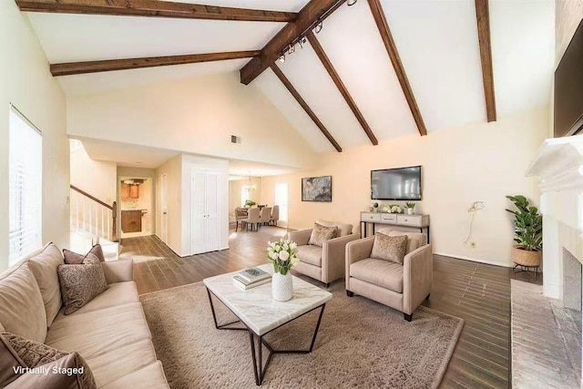 2707 Williams Grant St, Sugar Land, TX 77479 - living area featuring wood finished floors, stairway, high vaulted ceiling, beamed ceiling, and a fireplace