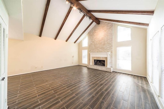 2707 Williams Grant St, Sugar Land, TX 77479 - unfurnished living room with beam ceiling, high vaulted ceiling, a large fireplace, and dark wood-style floors