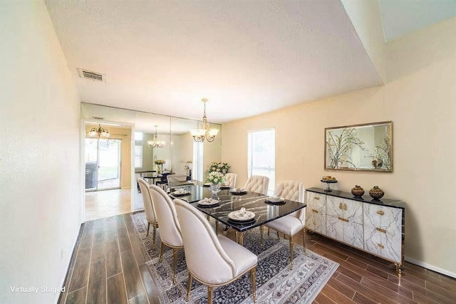2707 Williams Grant St, Sugar Land, TX 77479 - dining space with a chandelier, wood tiled floors, plenty of natural light, and baseboards