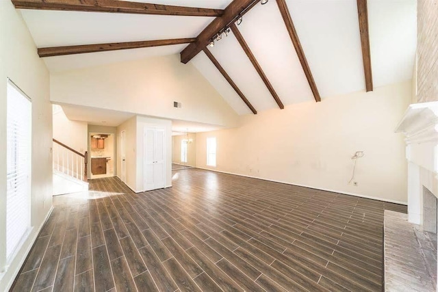 2707 Williams Grant St, Sugar Land, TX 77479 - unfurnished living room with stairs, beam ceiling, high vaulted ceiling, dark wood finished floors, and a fireplace