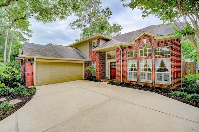 12911 Peach Meadow Dr, Cypress, TX 77429 - view of front facade featuring brick siding, roof with shingles, a garage, and driveway