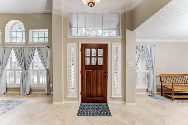 12911 Peach Meadow Dr, Cypress, TX 77429 - foyer entrance with tile patterned floors, plenty of natural light, ornamental molding, baseboards, and a high ceiling