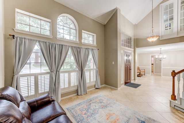 12911 Peach Meadow Dr, Cypress, TX 77429 - living area with high vaulted ceiling, healthy amount of natural light, light tile patterned floors, baseboards, and ornamental molding