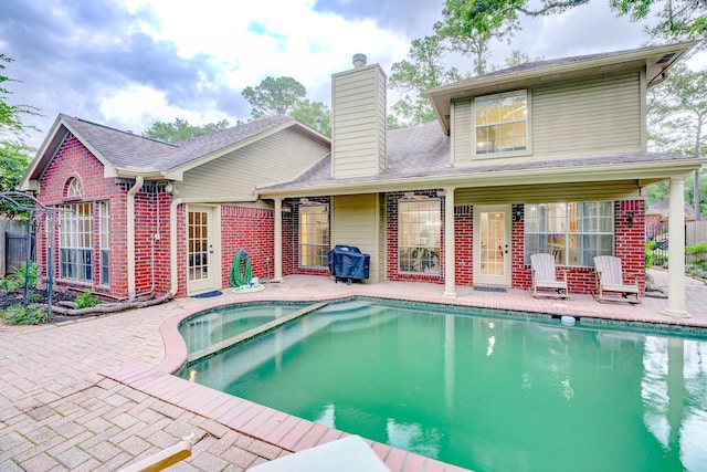 12911 Peach Meadow Dr, Cypress, TX 77429 - view of pool with a patio area, a pool with connected hot tub, and a grill