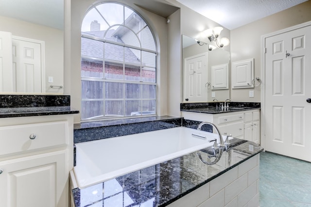 12911 Peach Meadow Dr, Cypress, TX 77429 - full bathroom featuring a garden tub, vanity, and tile patterned flooring