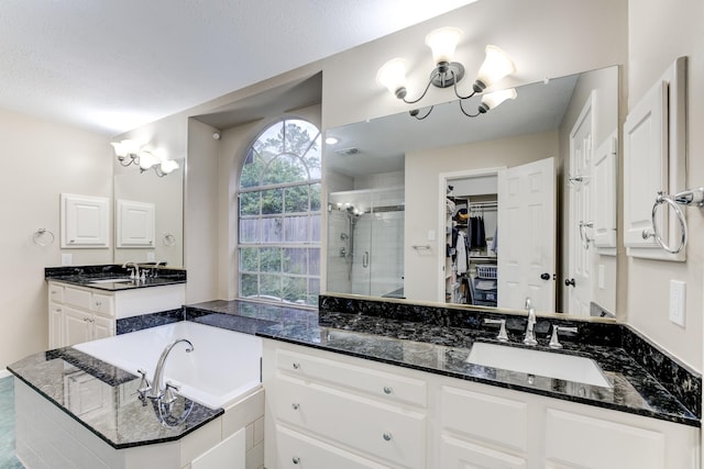 12911 Peach Meadow Dr, Cypress, TX 77429 - full bath with a stall shower, a chandelier, a bath, a walk in closet, and vanity