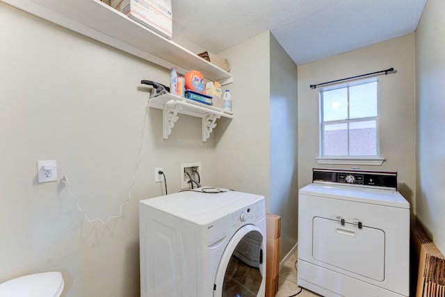12911 Peach Meadow Dr, Cypress, TX 77429 - washroom with washing machine and dryer, baseboards, and light tile patterned floors