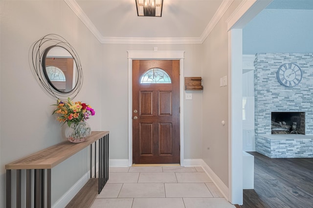 715 Cheltenham Dr, Katy, TX 77450 - foyer with ornamental molding, baseboards, and light wood-type flooring