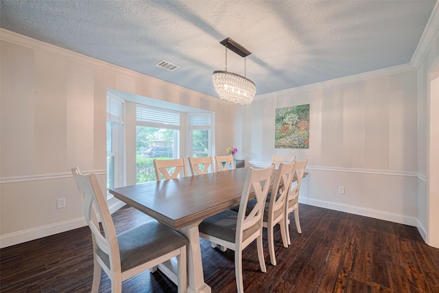 715 Cheltenham Dr, Katy, TX 77450 - dining room featuring a textured ceiling, a chandelier, wood finished floors, crown molding, and baseboards