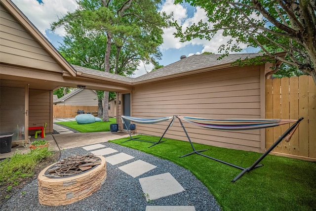715 Cheltenham Dr, Katy, TX 77450 - view of yard featuring an outdoor fire pit and a patio