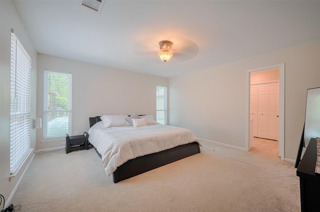 715 Cheltenham Dr, Katy, TX 77450 - carpeted bedroom featuring baseboards, multiple windows, and a ceiling fan