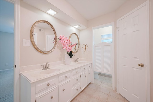 715 Cheltenham Dr, Katy, TX 77450 - full bathroom with double vanity and tile patterned flooring