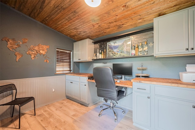 715 Cheltenham Dr, Katy, TX 77450 - home office with built in study area, wooden ceiling, a wainscoted wall, light wood finished floors, and vaulted ceiling
