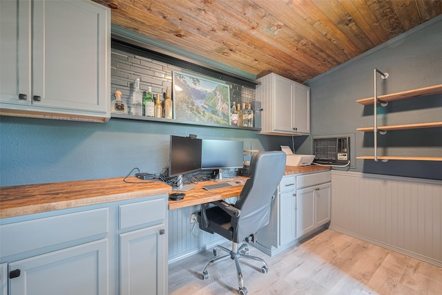 715 Cheltenham Dr, Katy, TX 77450 - office with wood ceiling, built in study area, light wood-type flooring, and a wainscoted wall
