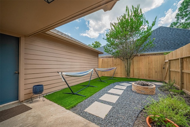 715 Cheltenham Dr, Katy, TX 77450 - view of yard with a fire pit, fence, and a patio