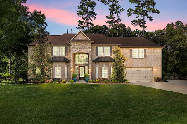4810 Pine Wood Meadows Ln, Spring, TX 77386 - view of front of property featuring a garage, concrete driveway, a front lawn, and brick siding