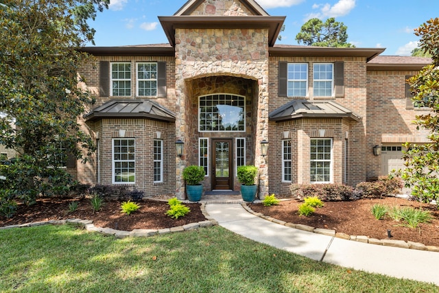 4810 Pine Wood Meadows Ln, Spring, TX 77386 - view of front of home with a standing seam roof and brick siding