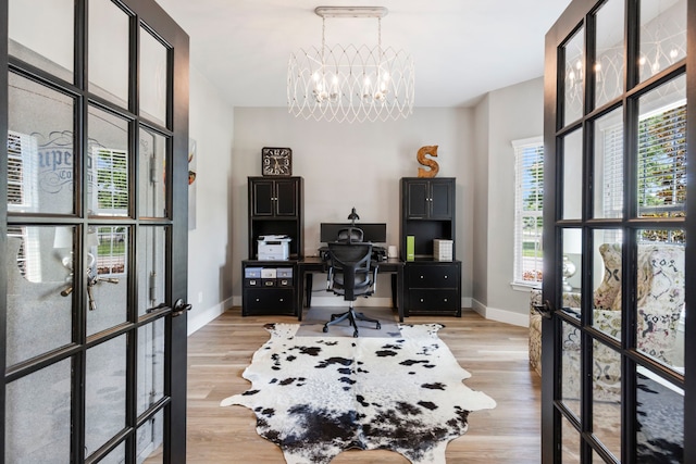 4810 Pine Wood Meadows Ln, Spring, TX 77386 - office featuring baseboards, a chandelier, light wood-style floors, and french doors