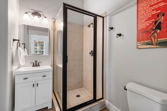 4810 Pine Wood Meadows Ln, Spring, TX 77386 - full bathroom with a shower stall, toilet, vanity, and baseboards