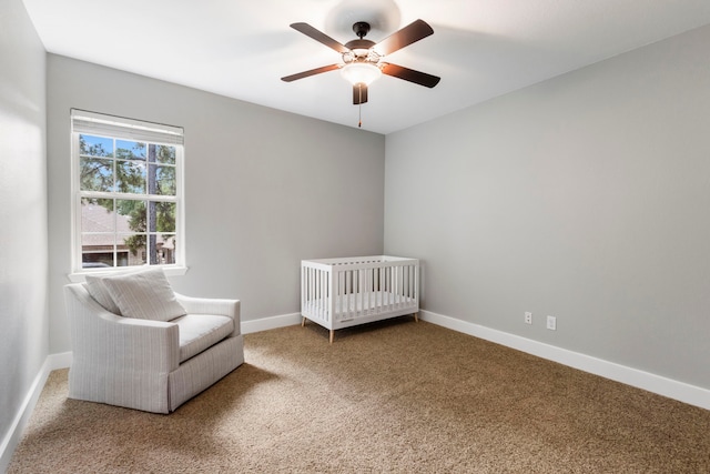 4810 Pine Wood Meadows Ln, Spring, TX 77386 - bedroom with carpet floors, baseboards, a ceiling fan, and a crib