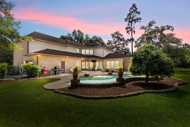 4810 Pine Wood Meadows Ln, Spring, TX 77386 - rear view of house featuring a patio area, an outdoor pool, and brick siding