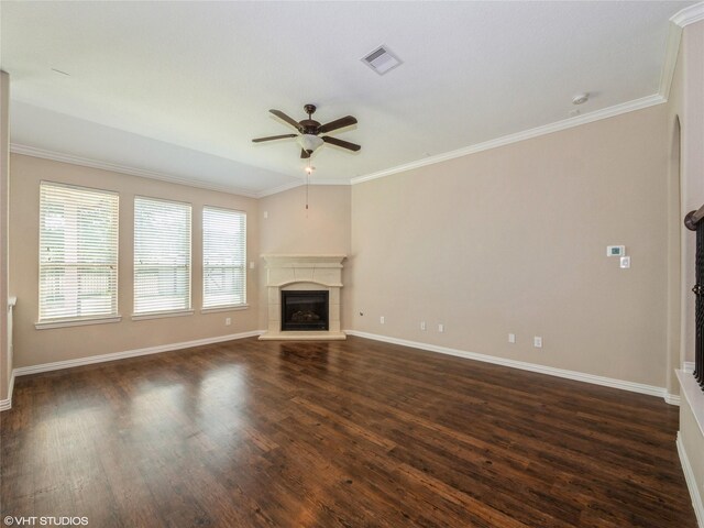 1322 Tee Time Ct, Crosby, TX 77532 - unfurnished living room featuring ceiling fan, a glass covered fireplace, baseboards, dark wood-type flooring, and ornamental molding