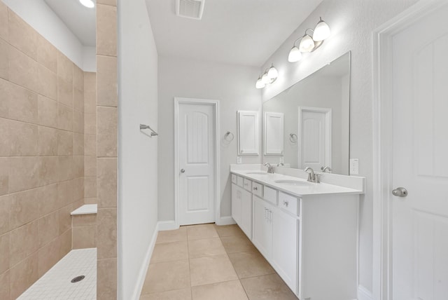 11826 Tranquility Summit Dr, Cypress, TX 77433 - full bath featuring tile patterned floors, tiled shower, double vanity, and baseboards