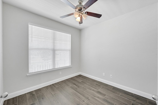 11826 Tranquility Summit Dr, Cypress, TX 77433 - spare room with baseboards, a ceiling fan, and dark wood-style flooring